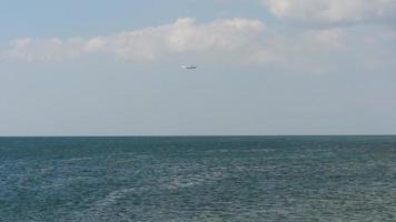 Airplane approaching over ocean video