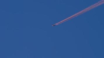 Red contrail of an airplane