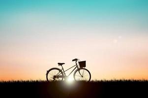 Silhouettes of bicycles parked in a beautiful photo