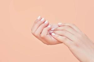 Beauty elegant female hands with manicure photo