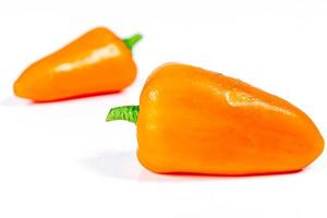 Orange bell pepper on a white background photo