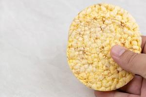 Crunchy Corn snacks in the hand with copy space photo