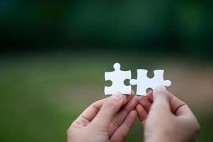 Hands and puzzles, important pieces of teamwork Teamwork concept photo