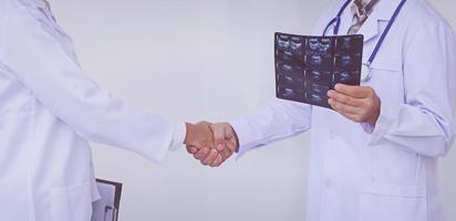 Doctors holding a clipboard with prescription, concept teamwork photo