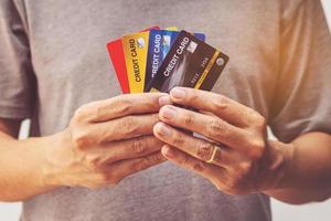 man showing bunch of credit cards photo