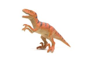 Plastic velociraptor toy isolated on white background photo