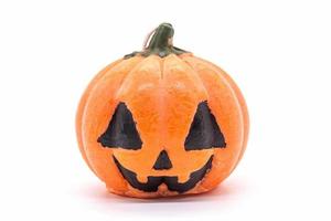 candle toy pumpkin for halloween decoration isolated on white background photo