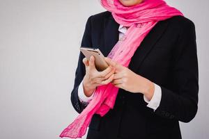 Arab businesswoman messaging on a mobile phone photo
