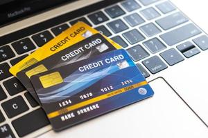 Credit card on a computer keyboard. internet purchase concept photo