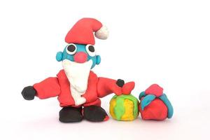 play doh sculpture of Santa Claus on white background photo