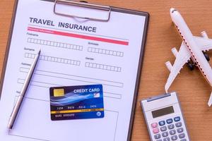 Travel  insurance form with model and policy document photo