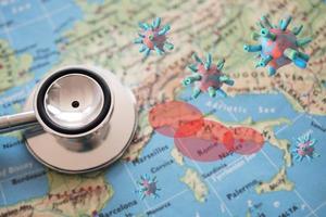 Stethoscope on Italy map background. outbreak of the virus covid-19 in Italy red zone photo