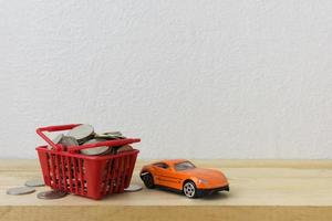 Basket red with car and coins for money concept photo