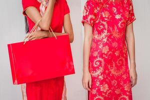 Chinese women friends enjoying shopping, woman wear cheongsam photo