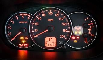 Modern car illuminated dashboard closeup photo