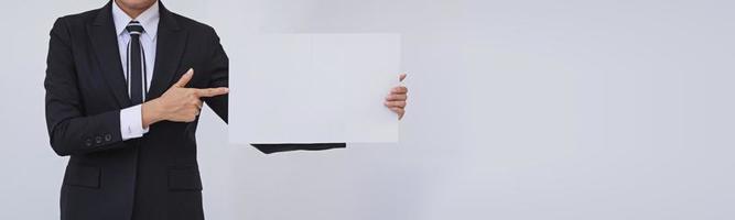 Asian businesswoman holding a blank white card photo