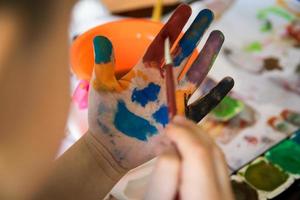 Smiling colorful children hands photo