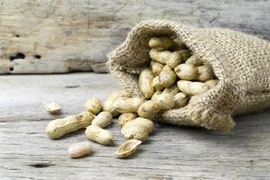 peanut on wooden background photo