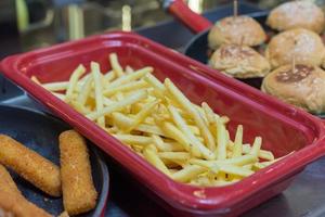 Closeup of home made French fries and burgers photo