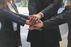 Group of business people joining hands. Team work concept. photo