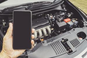 Man Phoning For Help with a broken down car photo