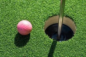 Golf ball on artificial grass. photo