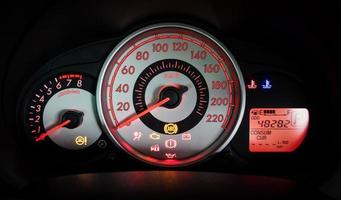 Modern car illuminated dashboard closeup photo