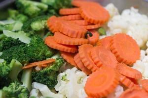 broccoli cauliflower and carrots on table photo