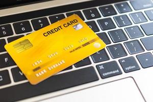 Credit card on a computer keyboard. internet purchase concept