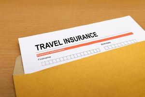 travel Insurance application form on brown envelope photo