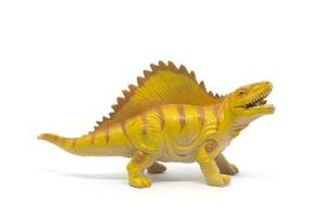 Plastic dinosaur toy isolated on white background photo