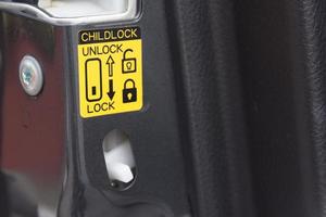 lock button to prevent children from opening doors photo