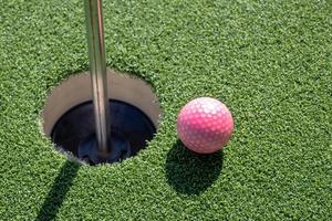 Golf ball on artificial grass. photo