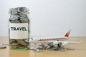 Money saving for travel in the glass bottle photo