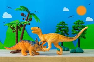 Dinosaur fight scene on wild models background photo