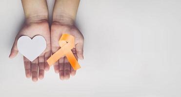 child holding gold ribbon. Cancer awareness photo