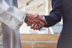 Arab businessmen worker handshaking on construction site photo