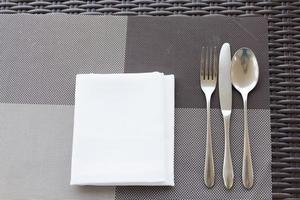 Luxurious fork and spoon on the dining table photo