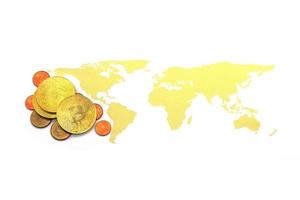 Bitcoin on world map and on white background. photo