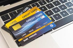 Credit card on a computer keyboard. internet purchase concept photo