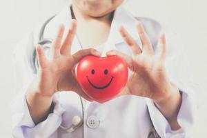 Asian girl playing as a doctor care healthy heart photo