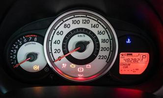 Modern car illuminated dashboard closeup photo