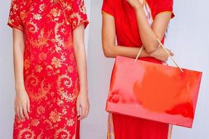 Chinese women friends enjoying shopping, woman wear cheongsam photo