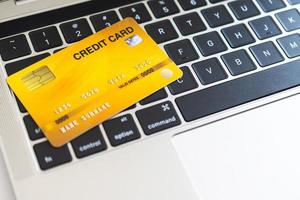 Credit card on a computer keyboard. internet purchase concept photo