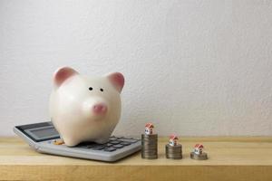 piggy bank with house and coins photo