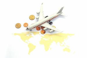 Airplane and world map on white blackground, Travel concept photo