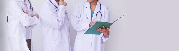 Doctors holding a clipboard with prescription photo