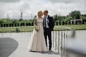 The bride and groom are hugging. photo