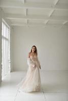 Portrait of a beautiful bride close-up on a white background. photo