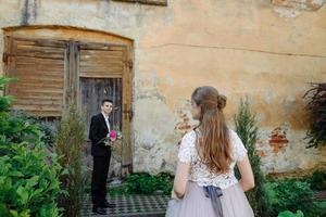 Lovely wedding couple kissing in the city photo